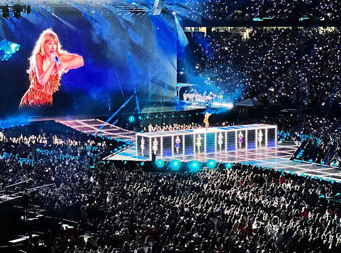 Taylor Swift perfroming at a crowded Gillette stadium