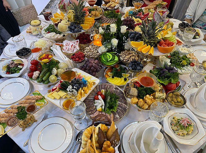 A table filled with a lot of plates of food
