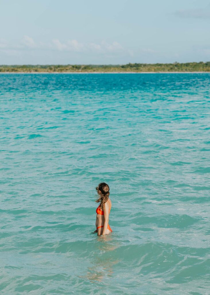 Wading in the water in the Bacalar lagoon of seven colors