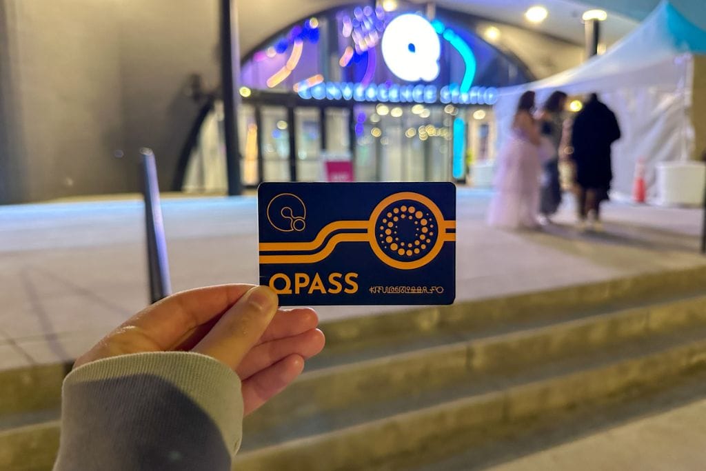 A picture of the Q pass card that you can purchase and use to interact with terminals at Convergence Station.