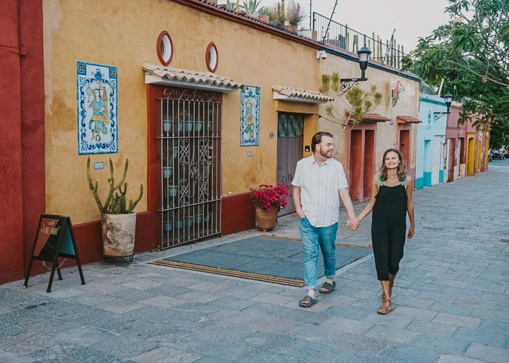 Couple walking through the streets of Oaxaca City 
