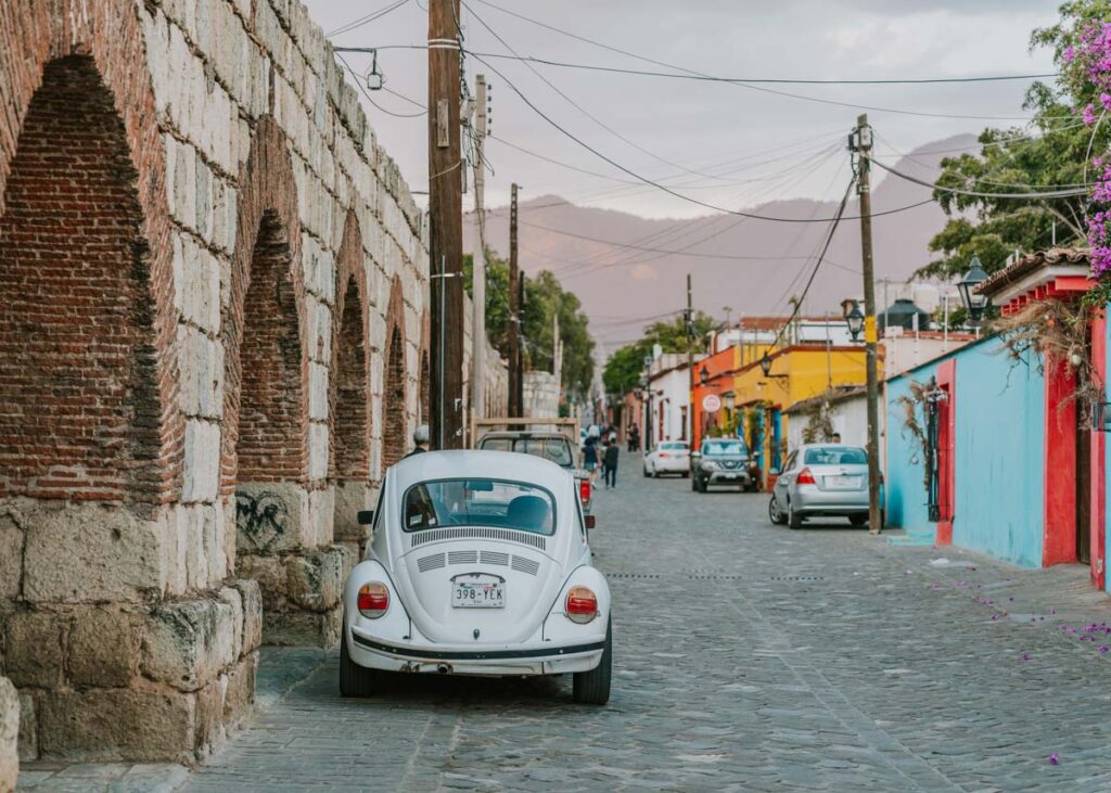 Vintage VW bug and colorful buildings in Oaxaca de Juarez 