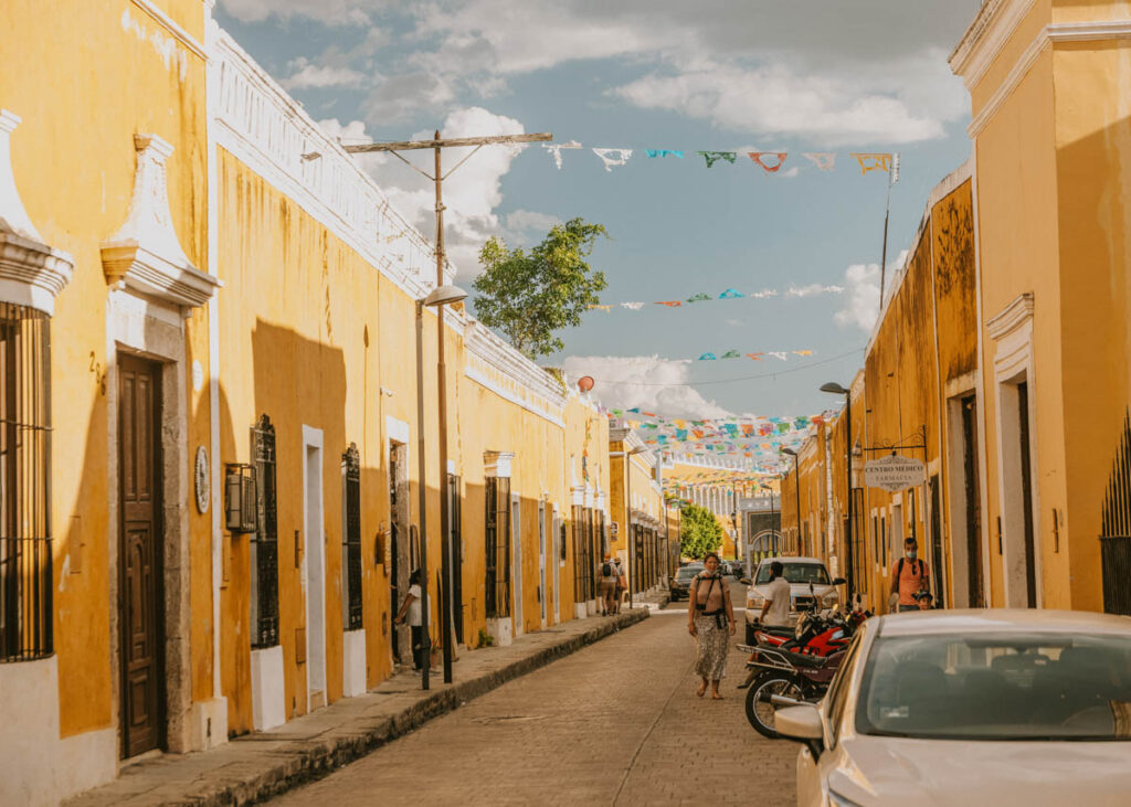 Yellow buildings lining the street in Izamal, Mexico