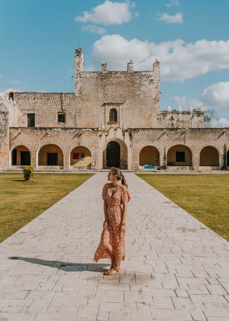 Woman standing in front of the convent in Valladolid Mexico