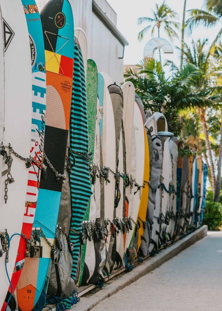 Surfboards lined up along an alleyway in Waikiki, Hawaii, photo caption for island quotes