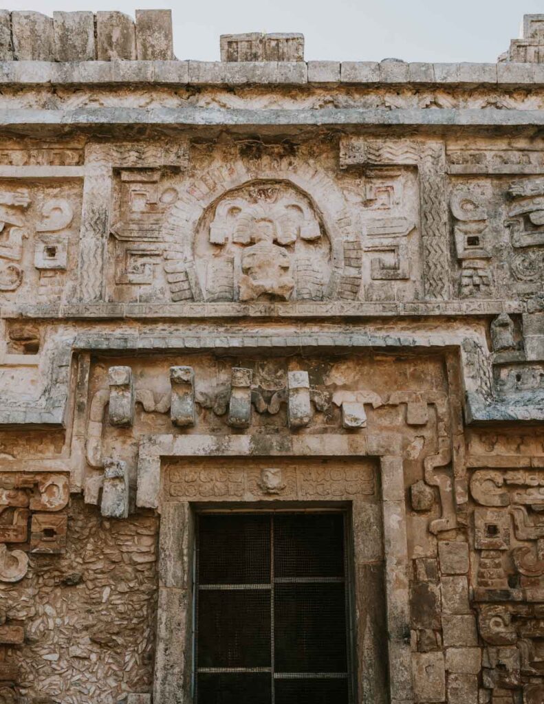 Facade of ancient Mayan building at Chichen Itza, one of the best day trips from Cancun Mexico